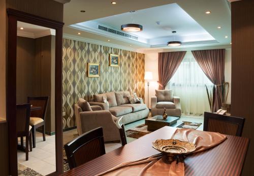 a living room filled with furniture and a table at Safari Hotel Apartment (Formerly Ewa Safari) in Jeddah