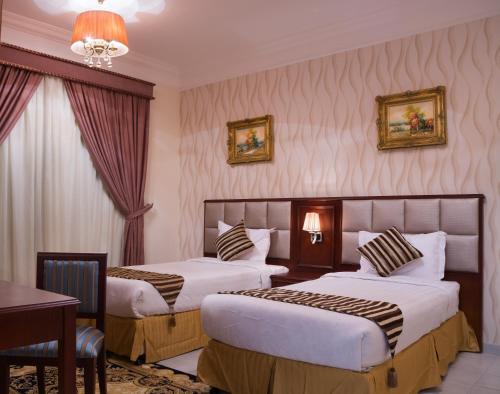 Кровать или кровати в номере Safari Hotel Apartment (Formerly Ewa Safari)
