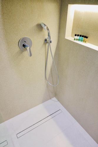 a shower in the corner of a bathroom at RIO Hotel in Samarkand
