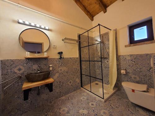 a bathroom with a sink and a mirror at Complex Butoaiele Transilvaniei - Cazare & SPA - Natura - Relaxare in Mediaş