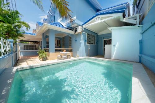 a swimming pool in front of a house at Bangla Patong Pool Villas with 4 Villas different designs choose fro, photo before Book in Patong Beach