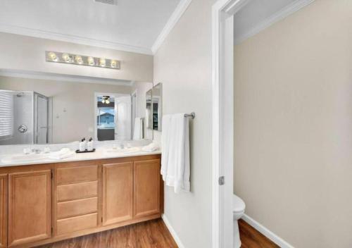 a bathroom with a sink and a mirror at Seven Palms in Henderson
