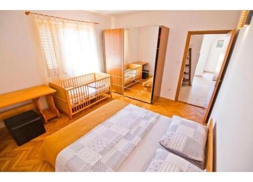 Postel nebo postele na pokoji v ubytování Apartment Mana