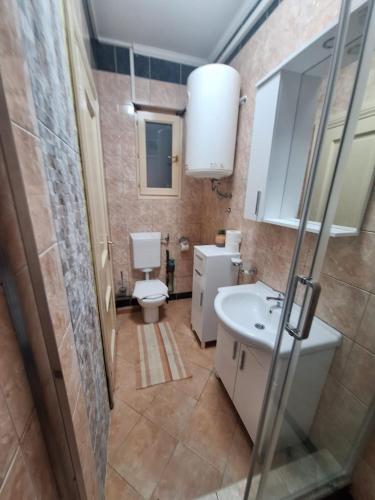 a bathroom with a toilet and a sink at Montesan Luxury Apartment Beach Front in Sveti Stefan
