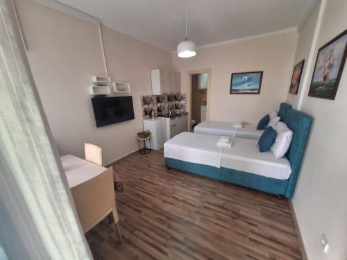 a small room with a bed and a tv at Montesan Luxury Apartment Beach Front in Sveti Stefan