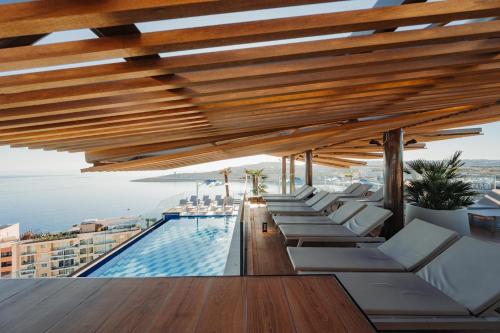 a pool on the roof of a building at Best Western Premier Malta in St Paul's Bay