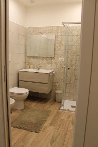a bathroom with a toilet and a sink and a shower at Guest House Esty in Rome
