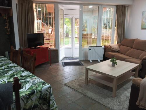 a living room with a couch and a table at Sierra Nevada in Sierra Nevada