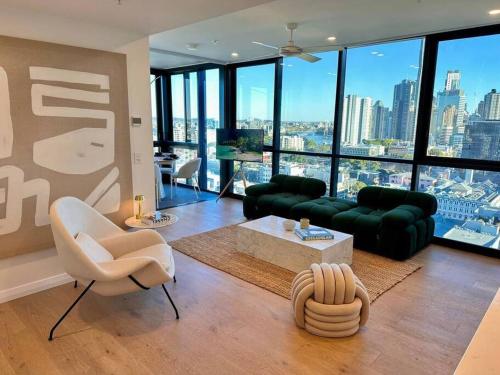 a living room with a view of a city at Utopia City Oasis Exquisite Urban Retreat in Brisbane