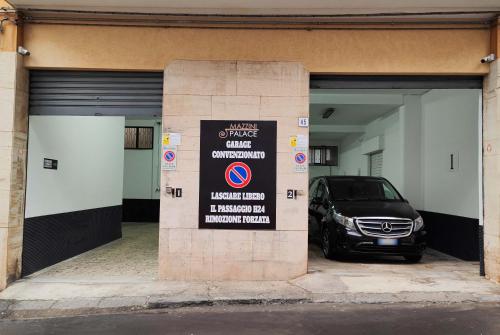 a parking garage with a car parked in it at MAZZINI PALACE in Misterbianco