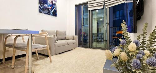 a living room with a couch and a table at Blue Wing Apartments in Colombo