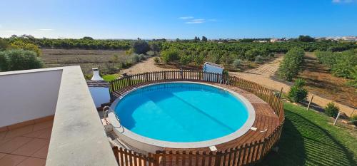 an overhead view of a swimming pool in a villa at Quinta da Bornacha - Casa A in Vila Nova De Cacela