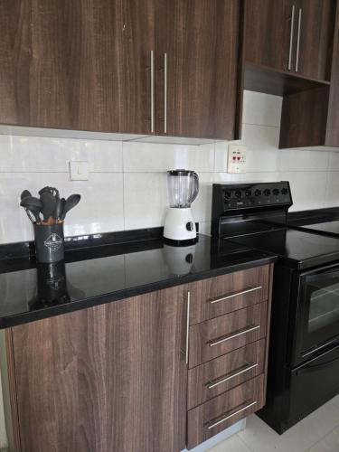a kitchen with a blender on a counter at Dk Casa in Lusaka