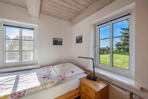 Postel nebo postele na pokoji v ubytování Ferienhaus Blick ins Tüterland