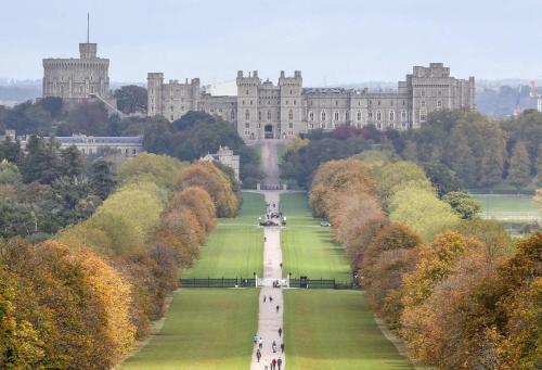 an aerial view of a large castle with trees at 1 Bed Serviced Apartment Bracknell with parking 5 mins from station in Bracknell
