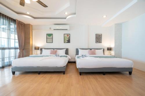 En eller flere senge i et værelse på Bangla house with 4 houses Pick house before BOOK