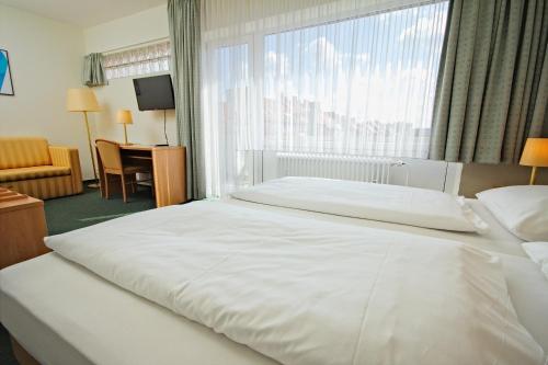 Cama o camas de una habitación en Hotel Wiking