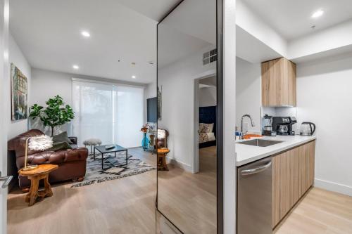 a kitchen and a living room with a couch at 15 City View Santa Monica in Los Angeles