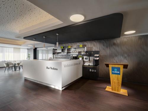 a large room with a counter and a kitchen at Clarion Congress Hotel České Budějovice in České Budějovice