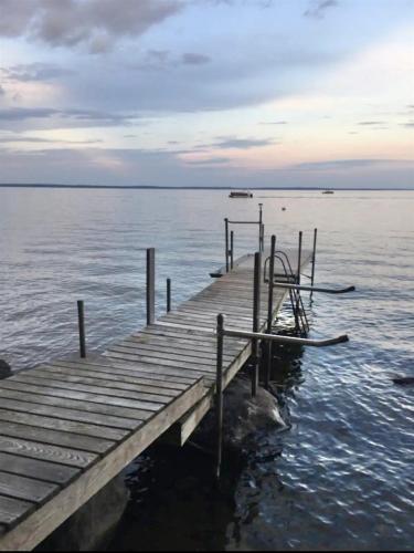 a dock on a body of water at DOCKSIDE RETREAT LIMIT 14 home in North Sebago