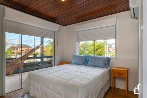 Ένα ή περισσότερα κρεβάτια σε δωμάτιο στο Casa acolhedora e confortável com 03 dormitórios