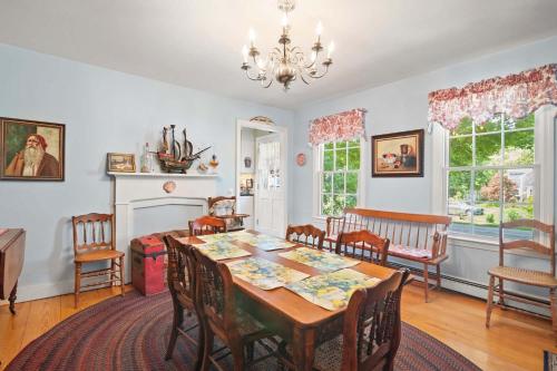 a dining room with a table and chairs at On the Chatham Loop - 1 Min to the Beach in Chatham