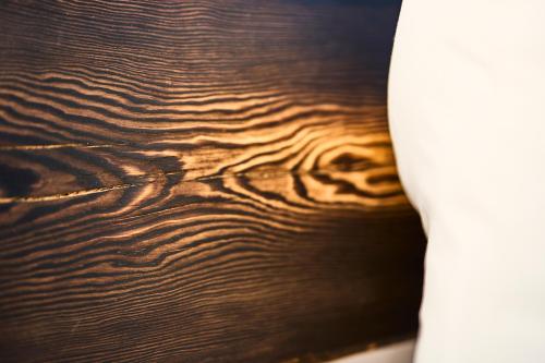 a close up of a wooden table with water at Gästehaus Zeitraum in Admont
