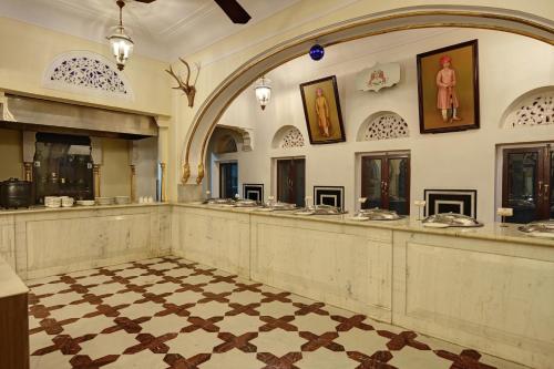 a bathroom with a long counter in a building at Shahpura Haveli in Shāhpura