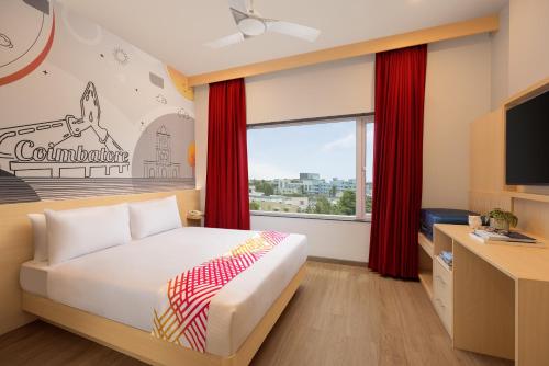 Una cama o camas en una habitación de Ginger Coimbatore Airport , Avinashi Road