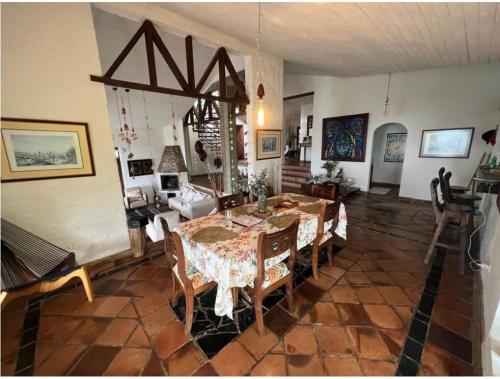 a dining room with a table and chairs at DAPA CASA CAMPESTRE CON PISCINA y JACUZZI in Dapa