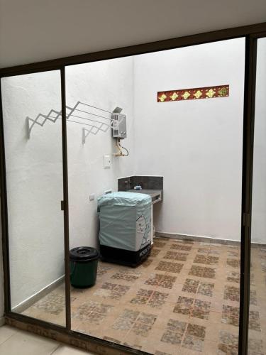 a room with a large glass door with a room with aperature at Casa Pino Campestre Panorámica in Jericó
