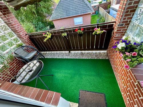 an overhead view of a balcony with a green pond at Casa Corina in Norden