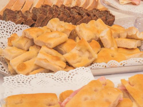 a bunch of different types of food on a table at Hotel San Pietro Palace in Finale Ligure