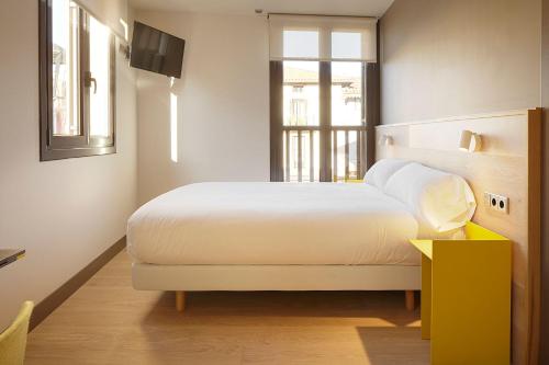 Postel nebo postele na pokoji v ubytování Hotel Imaz