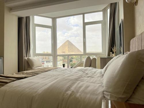 Voodi või voodid majutusasutuse Pyramids Wonders Hotel toas