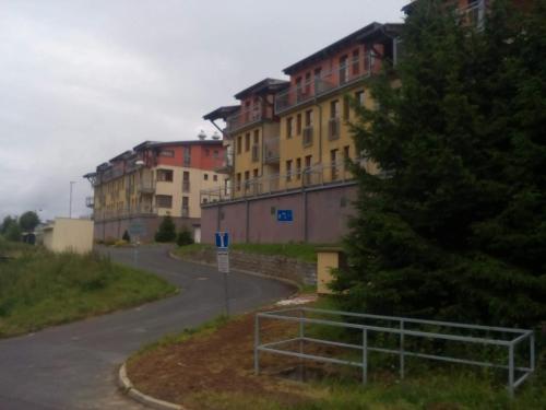 a street with buildings on the side of a road at Ski Apartmán Salomon in Loučná pod Klínovcem