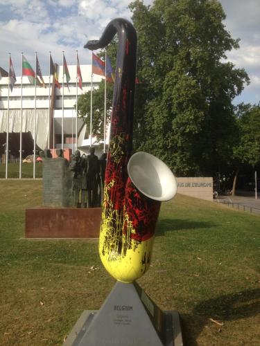 a sculpture of a instrument with a frisbee on it at La Résidence de l'Orangerie in Strasbourg