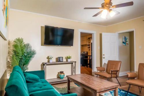 a living room with a couch and a table at Exquisite Rogers Park 1 bedroom, 1 bath Apartment Near Evanston in Chicago