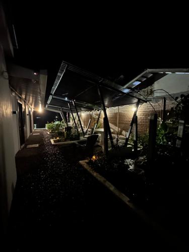 a night view of a house with a tent at Tortuguero7 lake view in Tortuguero