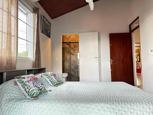 Ένα ή περισσότερα κρεβάτια σε δωμάτιο στο Villa Tassie logement entier à Capesterre