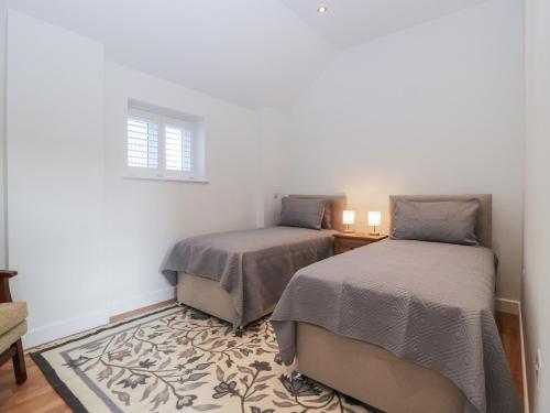 Postel nebo postele na pokoji v ubytování Doubletree Cottage