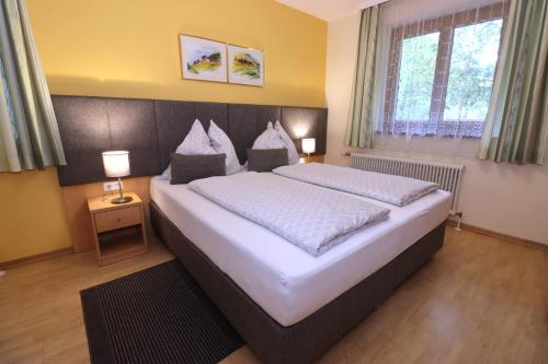 A bed or beds in a room at Appartement Dallavia