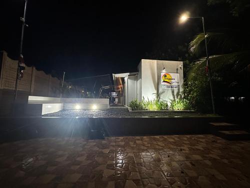a building at night with a street light at Tortuguero7 lake view in Tortuguero
