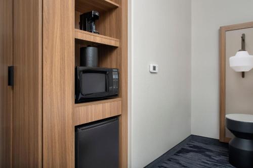 a room with a tv and a small microwave at Fairfield Inn & Suites by Marriott Boise West in Boise