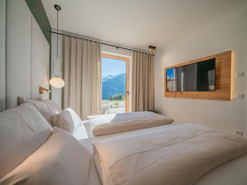 Postel nebo postele na pokoji v ubytování Premium Apartments AlmrauschEdelweiß