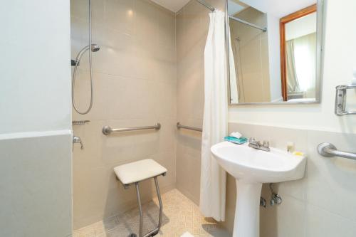 a bathroom with a sink and a shower at Comfort Inn Real San Miguel in San Miguel