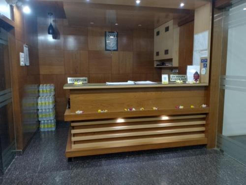 a store with a counter in a store at Shrinivas Lodge in Dhārwād