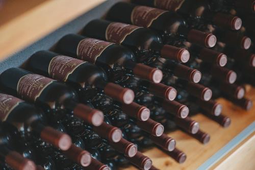a bunch of wine bottles sitting on a table at Tenuta Ronco Regio in San Fermo della Battaglia