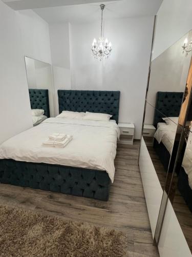 Ένα ή περισσότερα κρεβάτια σε δωμάτιο στο Central Cozy Apartament