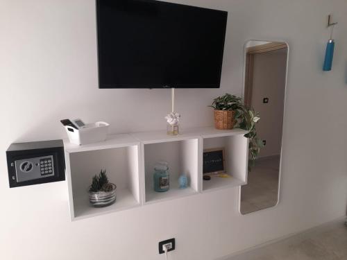 TV a/nebo společenská místnost v ubytování Nonno Rocco Guest House